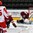 GRAND FORKS, NORTH DAKOTA - APRIL 24: Latvia's Gustavs Grigals #29 makes a glove save against Denmark while Denmark's Jonas Rondbjerg #15 and Latvia's Tomass Zeile #5 looks on during relegation round action at the 2016 IIHF Ice Hockey U18 World Championship. (Photo by Matt Zambonin/HHOF-IIHF Images)

